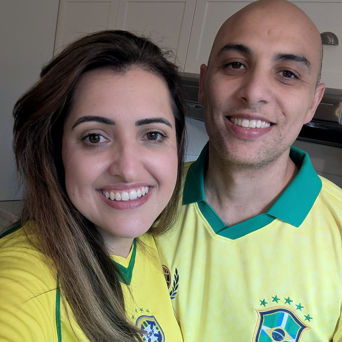 The founder and his wife at home, smiling.